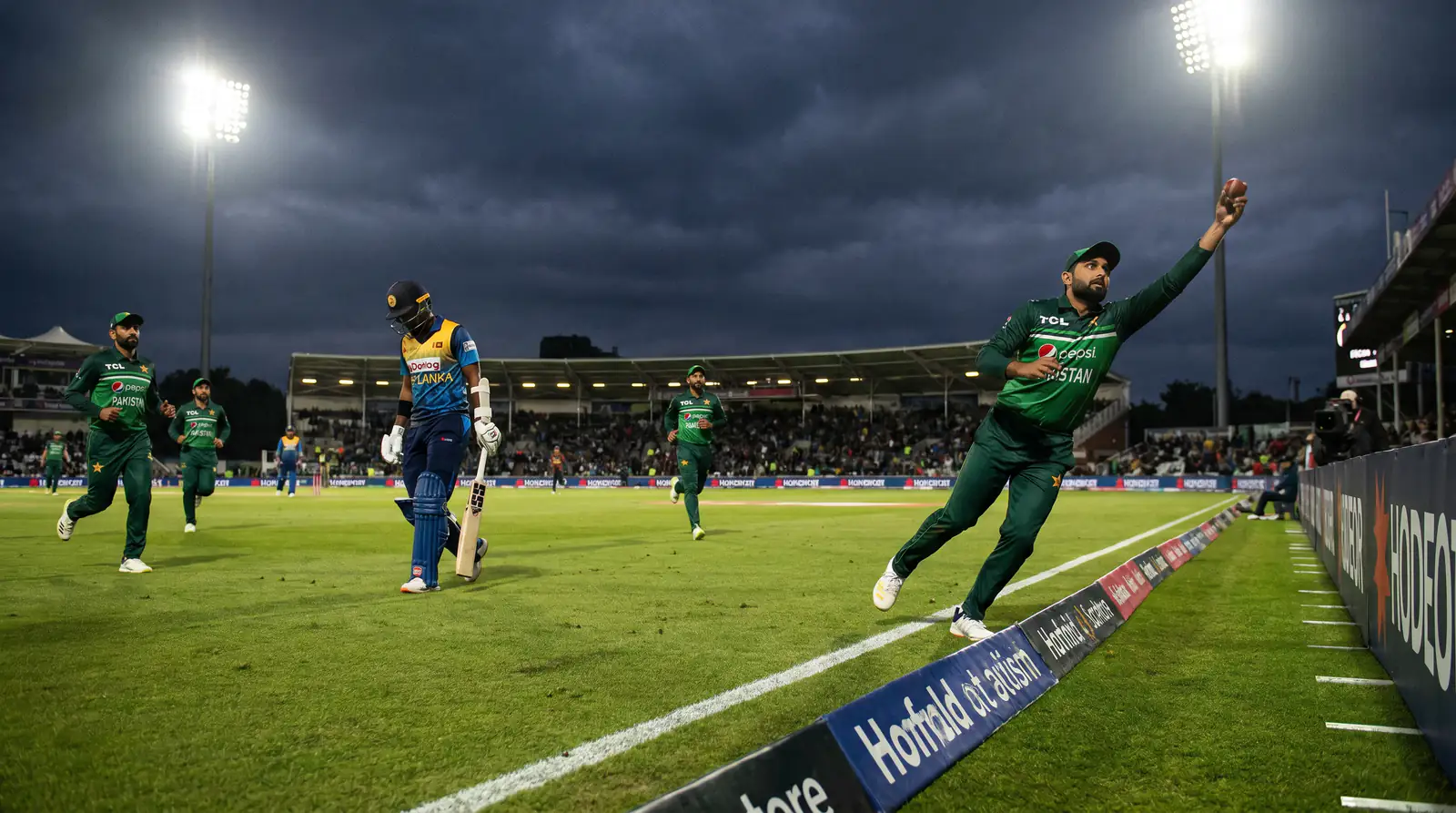 Cricket batsman caught out, illustrating volatile spread outcomes