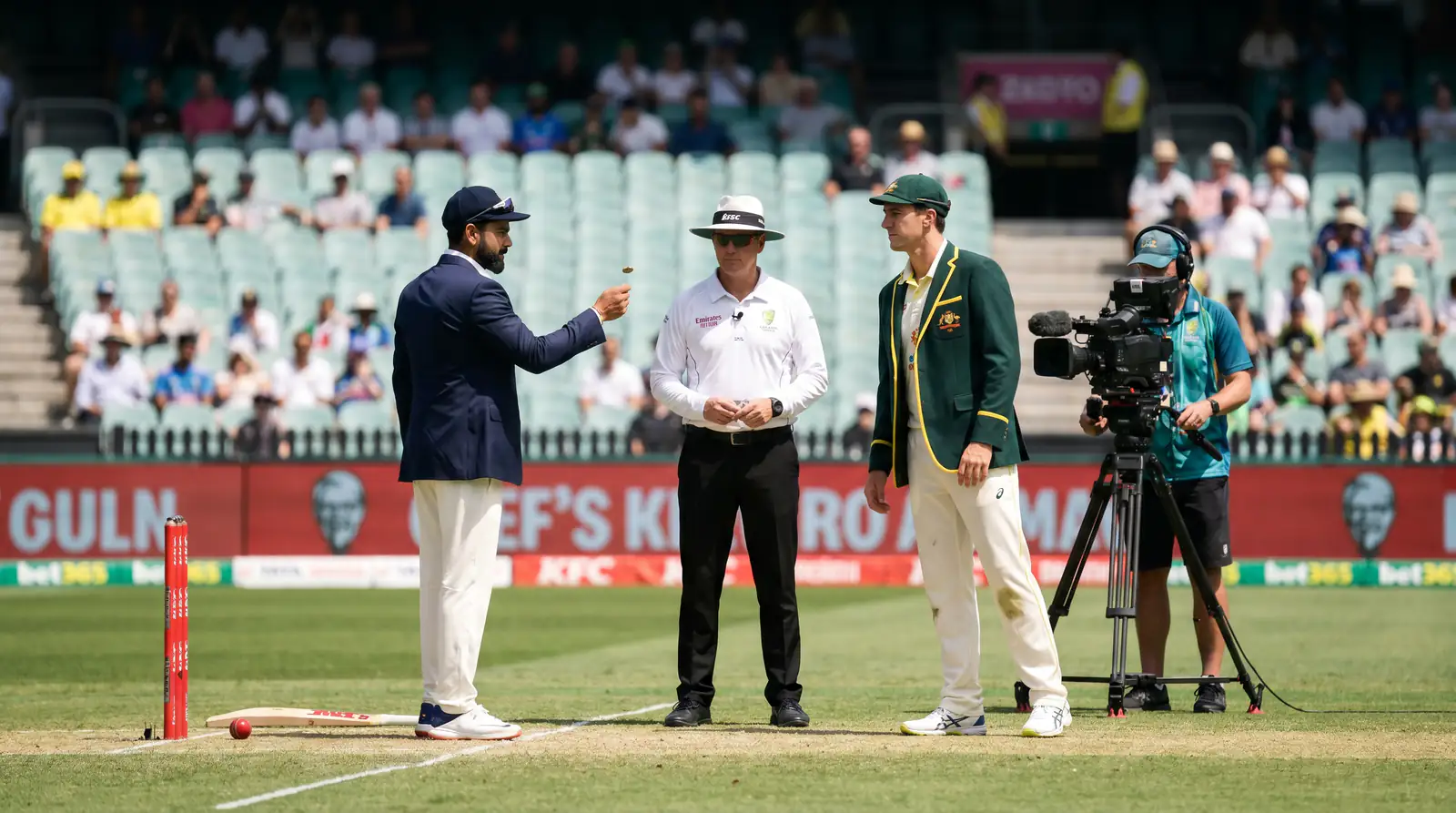 Two cricket captains at the toss with the match referee