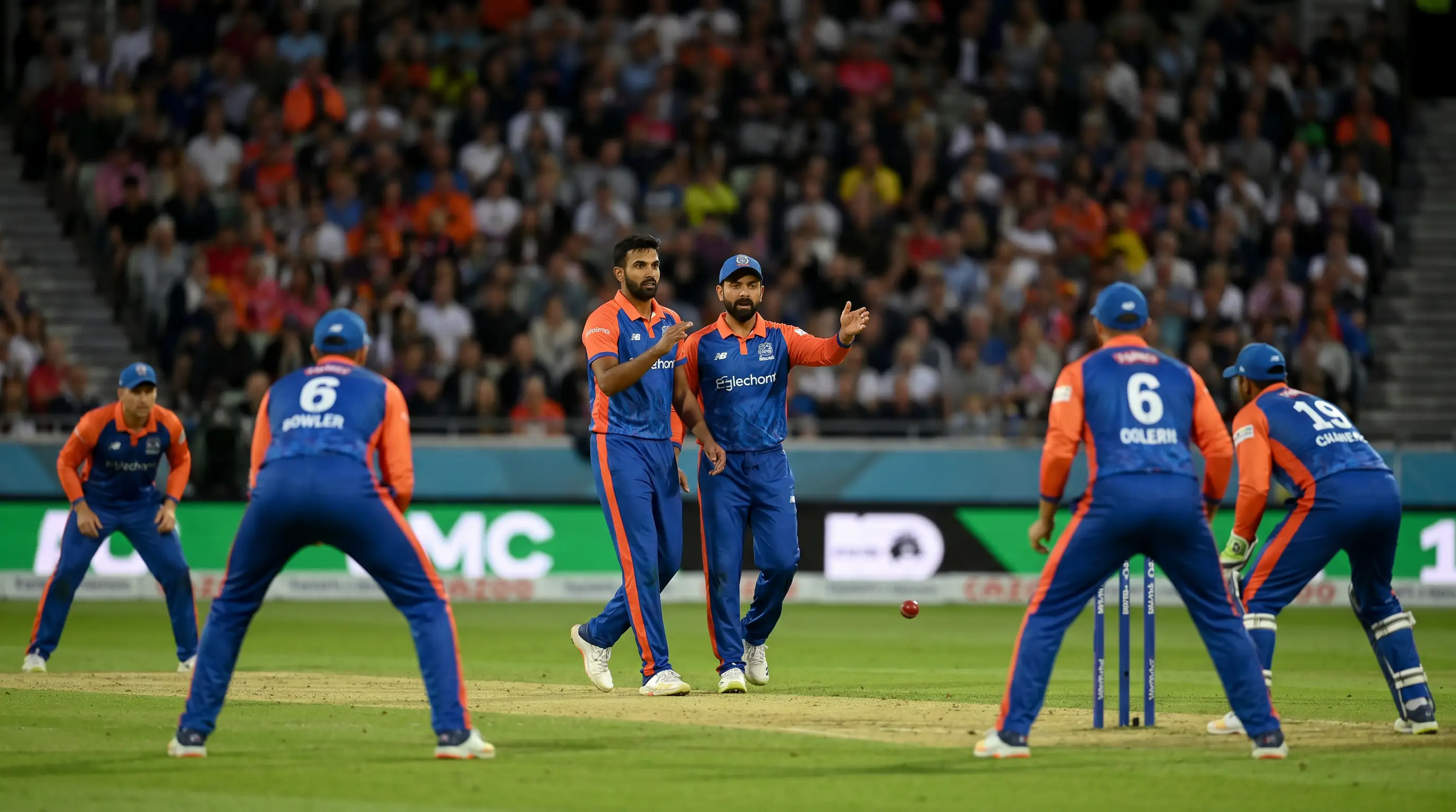 Bowler and captain setting a field in The Hundred