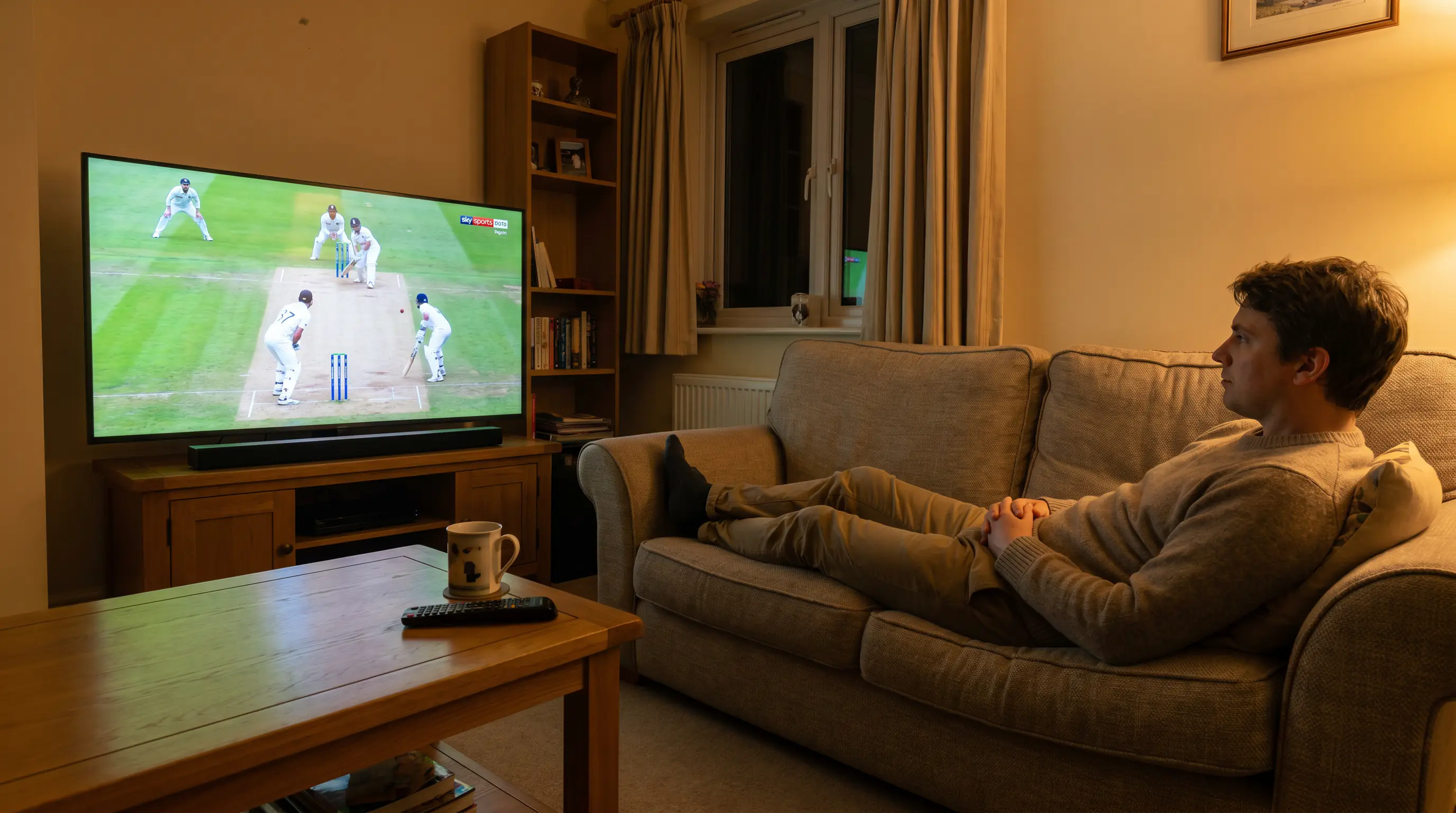 Patient cricket bettor calmly watching a match unfold