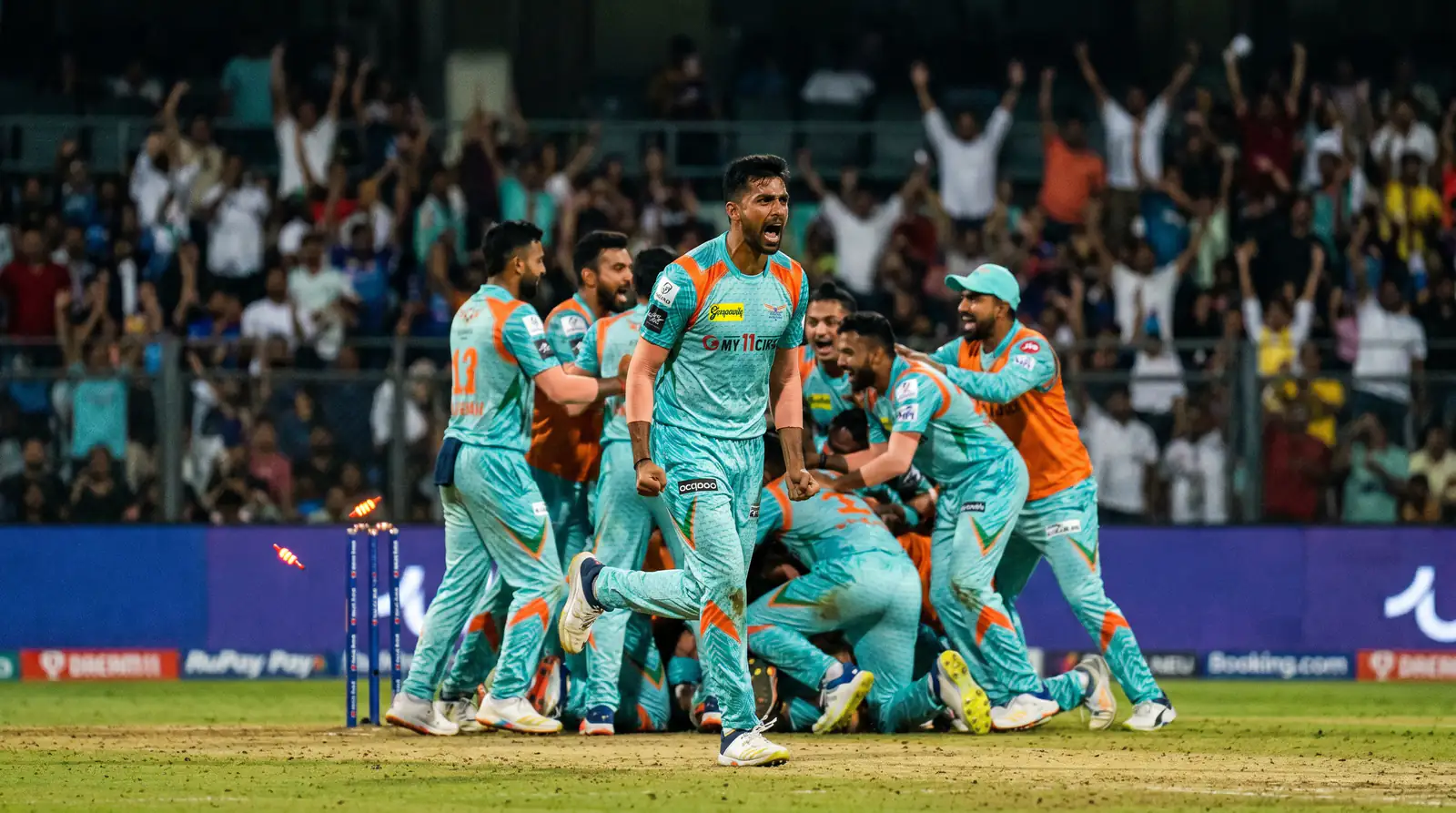 Bowler celebrating a decisive wicket in a T20 cricket match